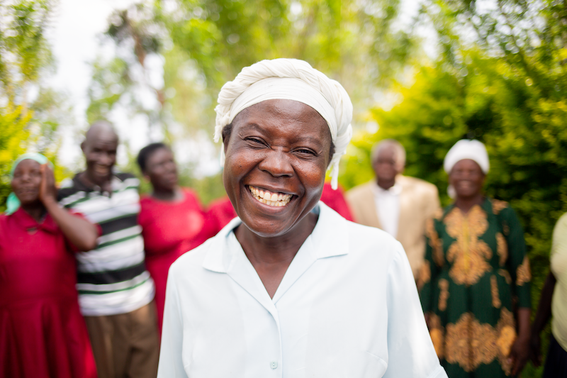 kenyan woman from hiv support group, smiling