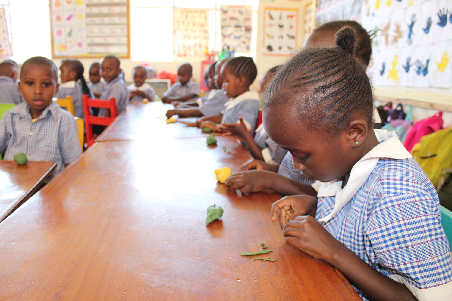 beacon of hope academy students sitting at a table