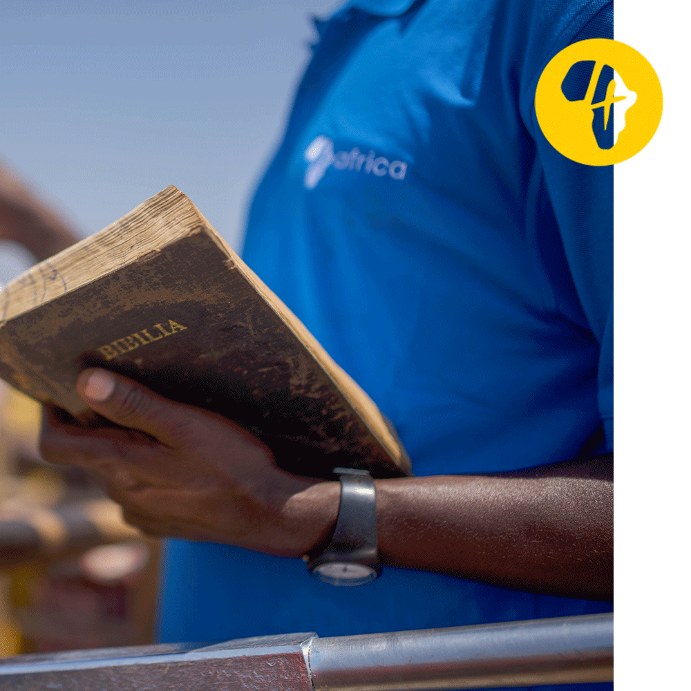 4Africa staff member holds a bible