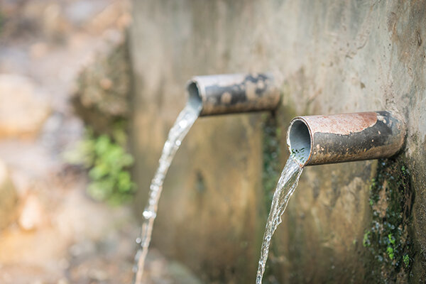 clean water flows from a piped water well system