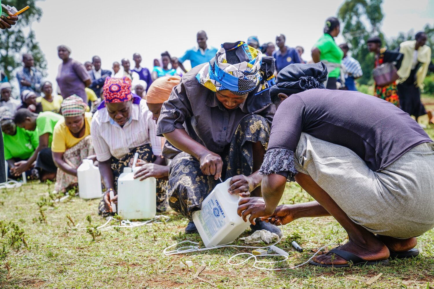 community members in kenya creating tippy taps