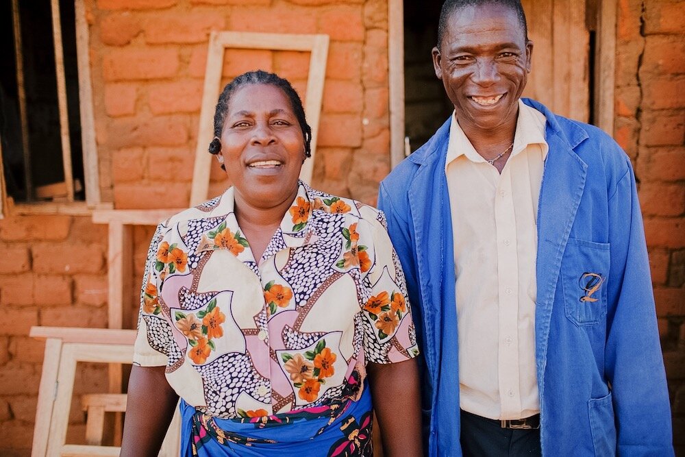 malawian couple smiles at camera