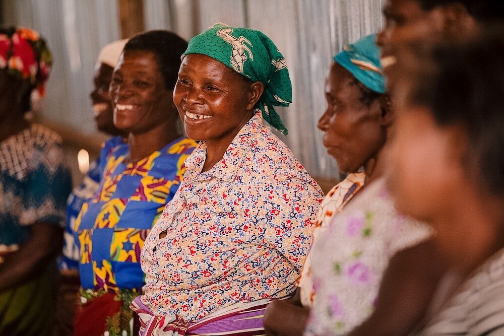 Woman smiling at an HIV support group in Malawi