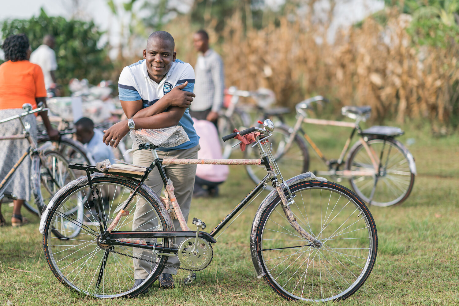 geoffrey, pact’s executive director, leans on bicycle