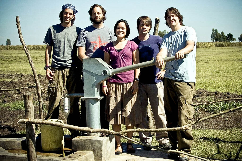 jars of clay and jena lee nardella in africa next to water well