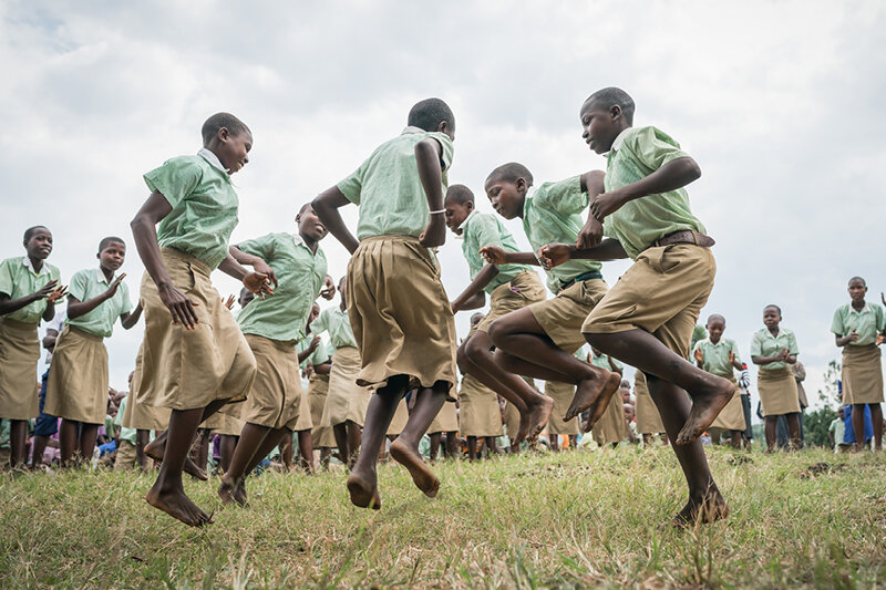 Group of african school children dancing