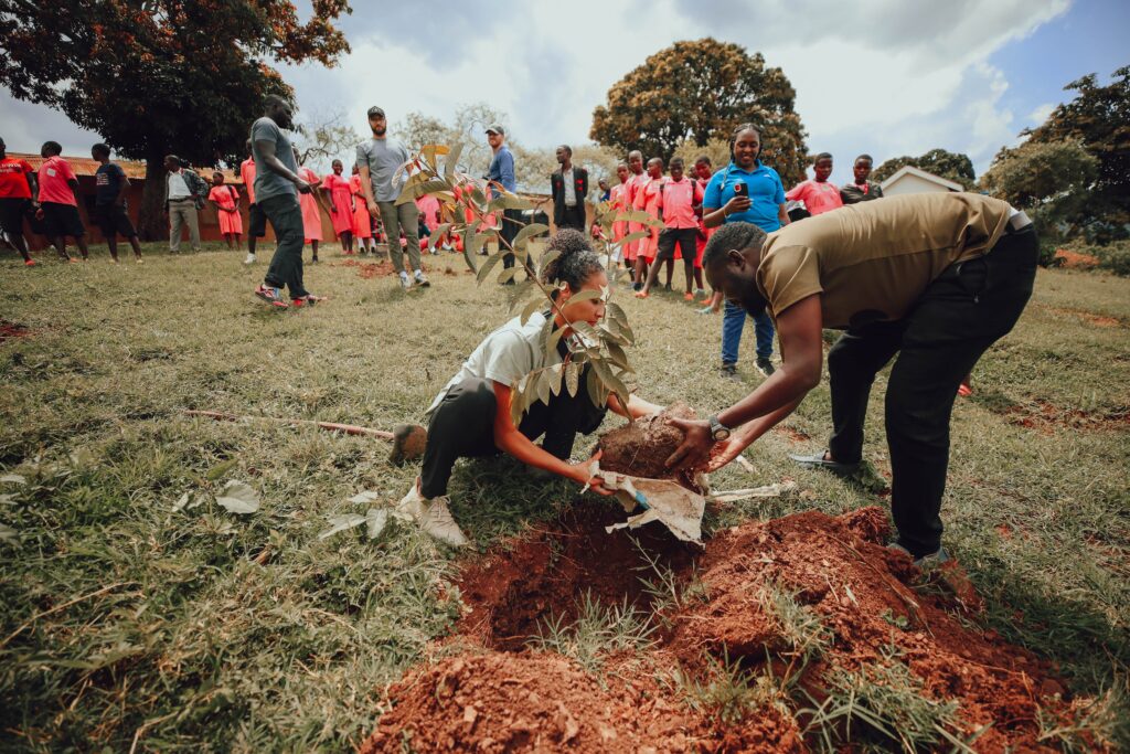 People planting a tree in Uganda